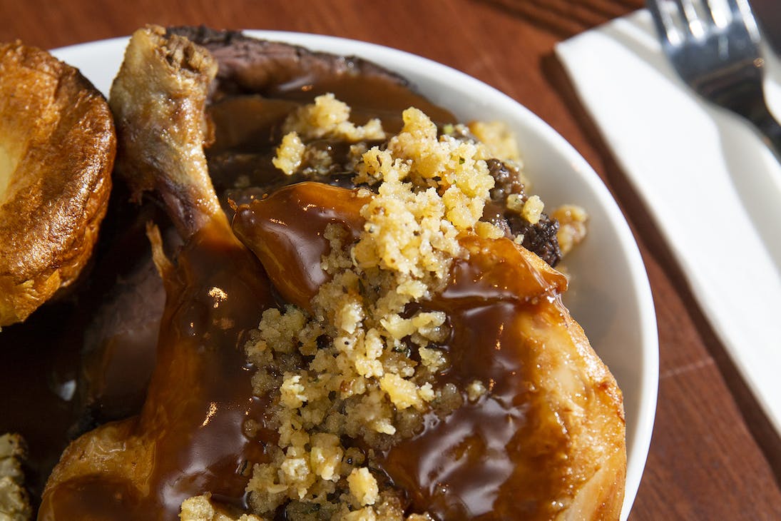 A roast dinner with stuffing and gravy